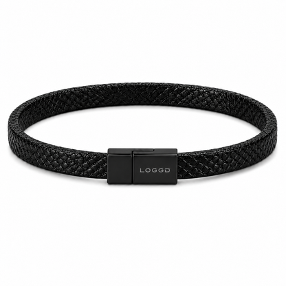 Black woven bracelet with a black clasp on a white background