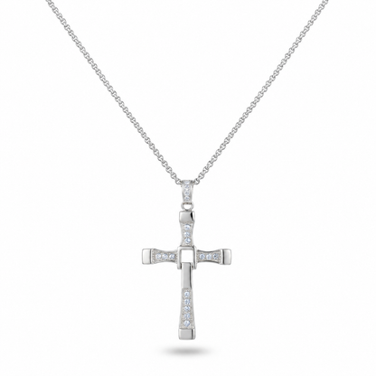 A silver cross pendant necklace adorned with small clear stones, suspended from a delicate silver chain against a plain white background.