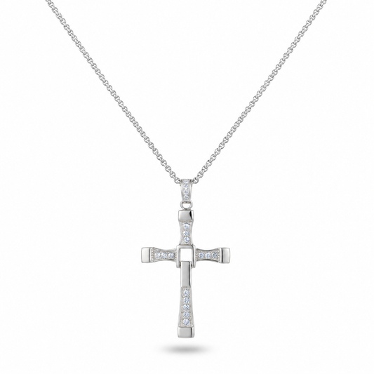 A silver cross pendant necklace adorned with small clear stones, suspended from a delicate silver chain against a plain white background.
