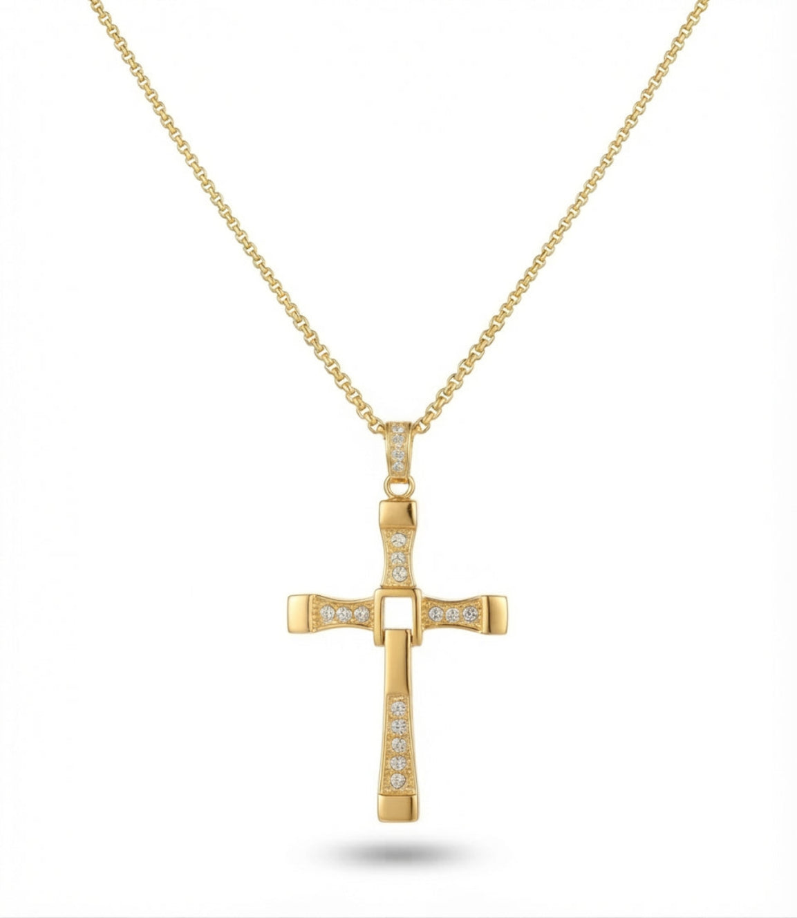 Gold Dominic Toretto style cross pendant necklace with sparkling stone accents displayed against a plain white background.