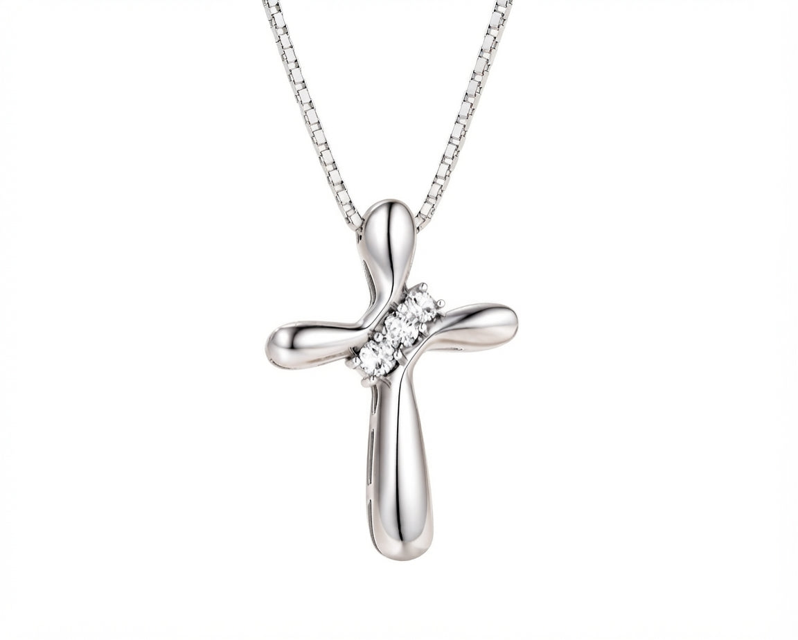 Sterling silver cross pendant necklace with sparkling stone accents displayed against a plain white background.