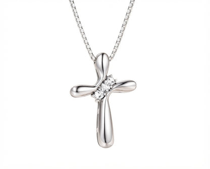 Sterling silver cross pendant necklace with sparkling stone accents displayed against a plain white background.